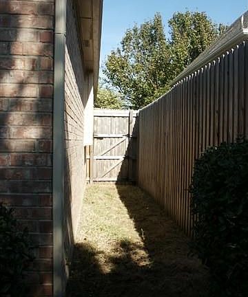 SIDE YARD WOULD MAKE IDEAL DOG RUN
