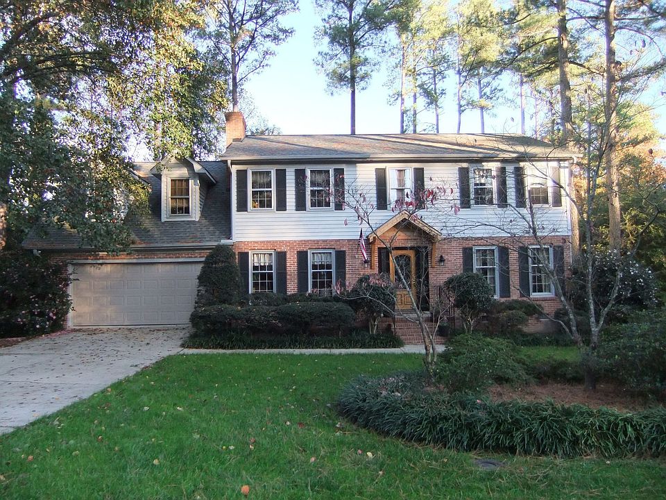 Front with park-like yard.