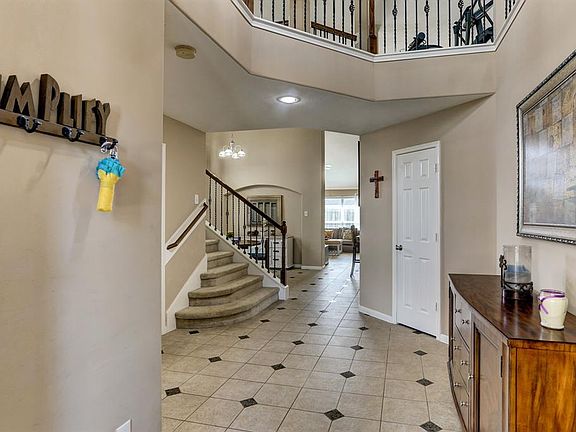 Looking all the way to the back of the house from the entrance is a unique perspective on this great lay out. Large Hallway closet to the right and guest bath to the left.