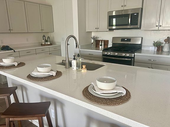 Ample storage with upgraded tall kitchen cabinets and soft-close drawers.