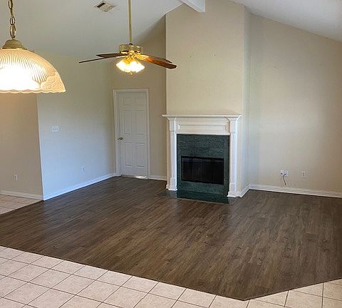 Living Area with vaulted ceiling and fireplace