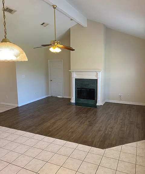 Living Area with vaulted ceiling and fireplace