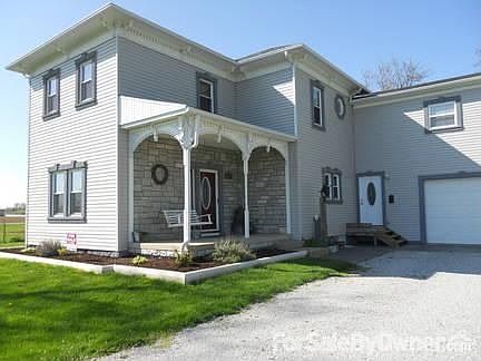 Front of house
						:
						Original dentalwork. New windows, siding, roof, and stone.