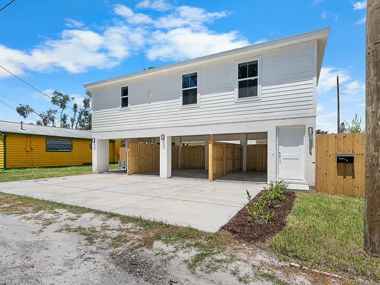 Front door of the unit is right next to the private carport.