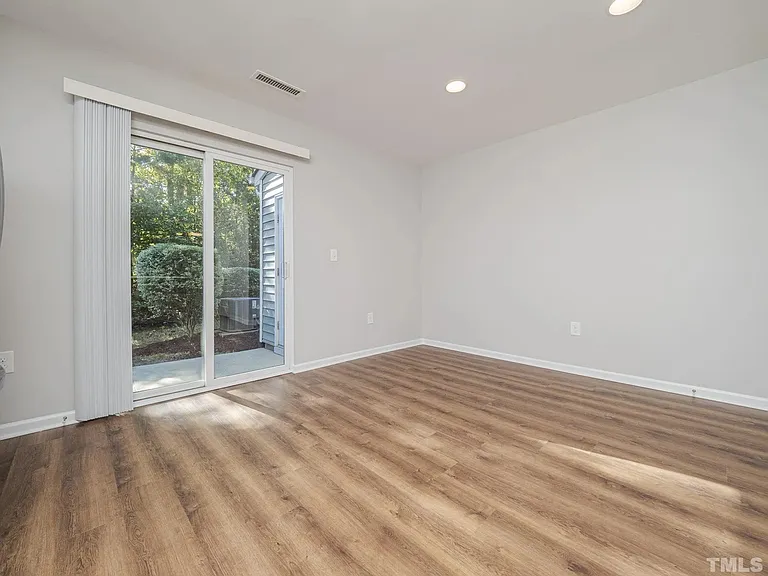 This is your view standing with your back to the modern quartz countertops. The space is large enough to accommodate a dining table with seating for 4 to 6, while having space to maneuver uninhibited while cooking with your modern appliances.