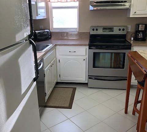 kitchen has a window view of the ocean
