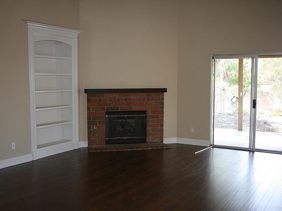 Family Room with gas log fireplace and built in