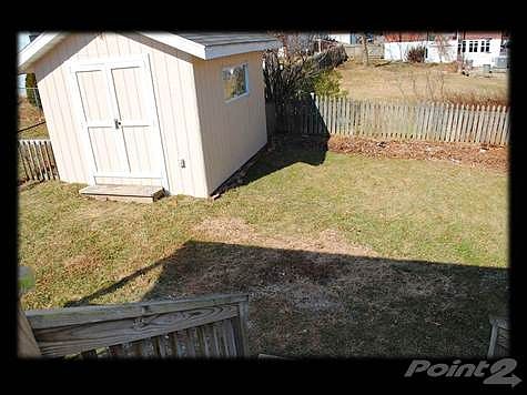 FULLY FENCED IN REAR YARD WITH SHED