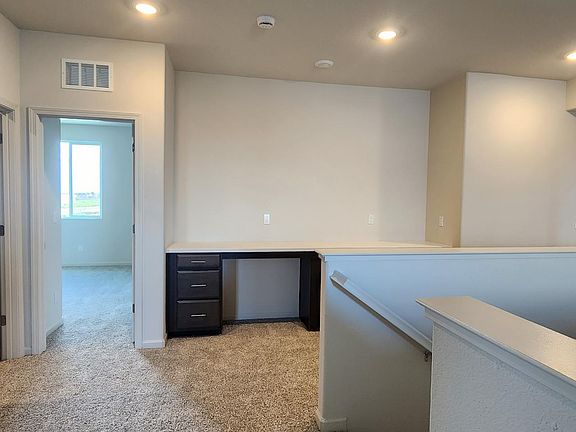 Upstairs, there is a laundry room, an office cabin for two people, and a space for a dent(room typically used as a secondary living space or office)