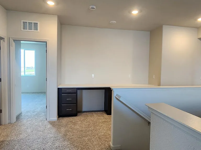 Upstairs, there is a laundry room, an office cabin for two people, and a space for a dent(room typically used as a secondary living space or office)