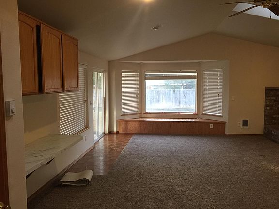 Great room with vaulted ceiling and bay window