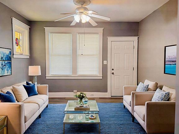View of living room, front door entrance on right