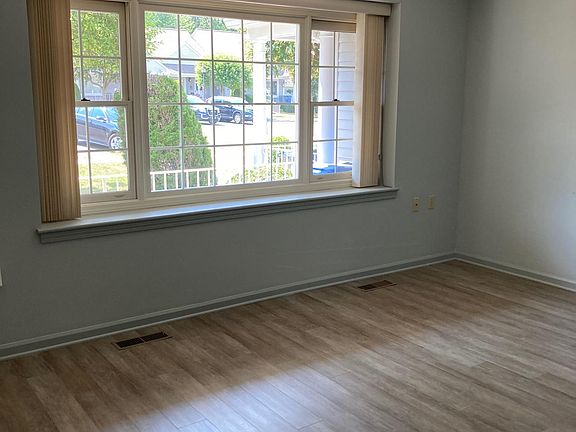 Living room. New easy-care Armstrong rigid core flooring.