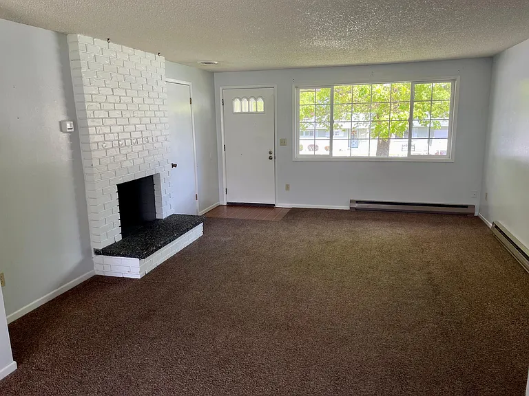 Upstairs living room with wood fire place
