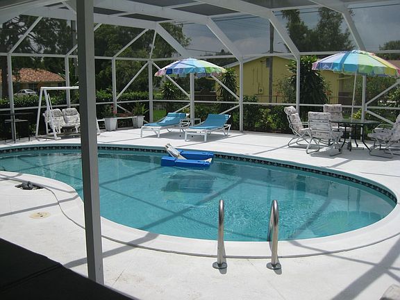 A very large pool deck offers bug free fun in the sun.