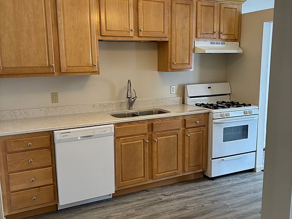 Kitchen with wood cabinets and new countertop