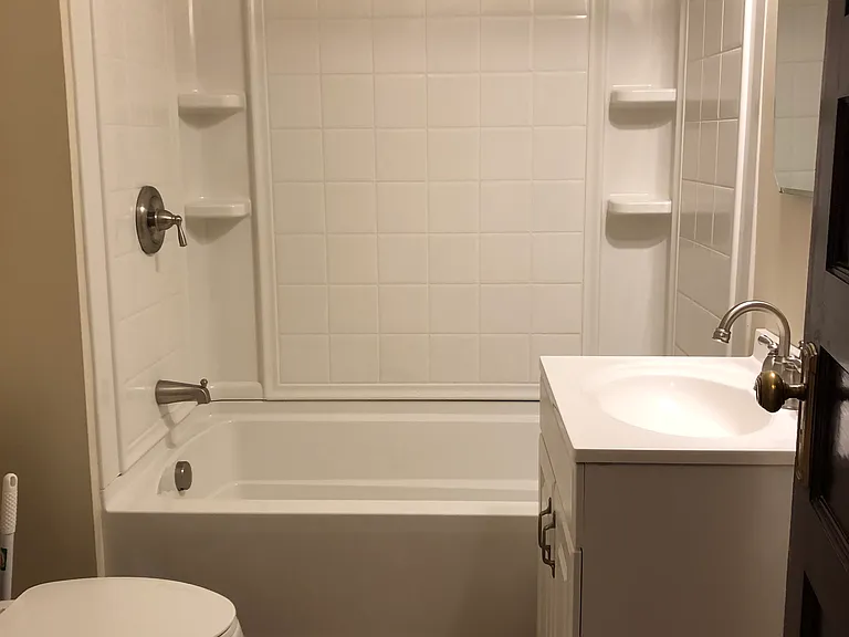 Bathroom with ceramic tile floor and deep soak tub/shower.