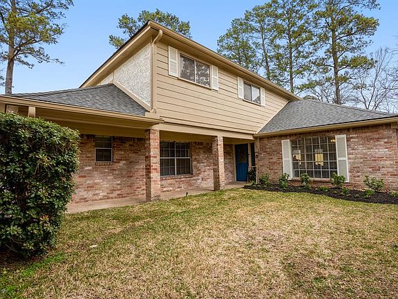 An adorable view from the right side of the home w/ the spacious yard & covered porch. You know, with all the new landscaping & the upcoming summer, you're going to have to keep the yard & plants watered. Well don't sweat it, there's a sprinkler syst