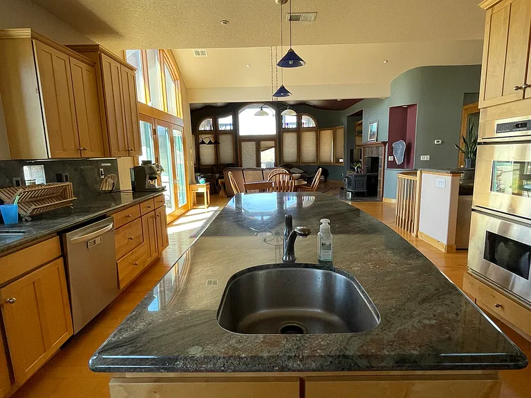 Spacious kitchen with prep sink in center island.