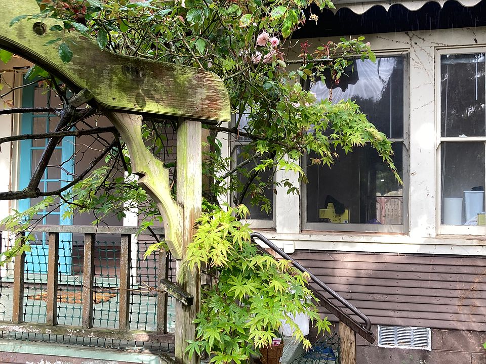 Rose arbor over the arch by the house and veranda.