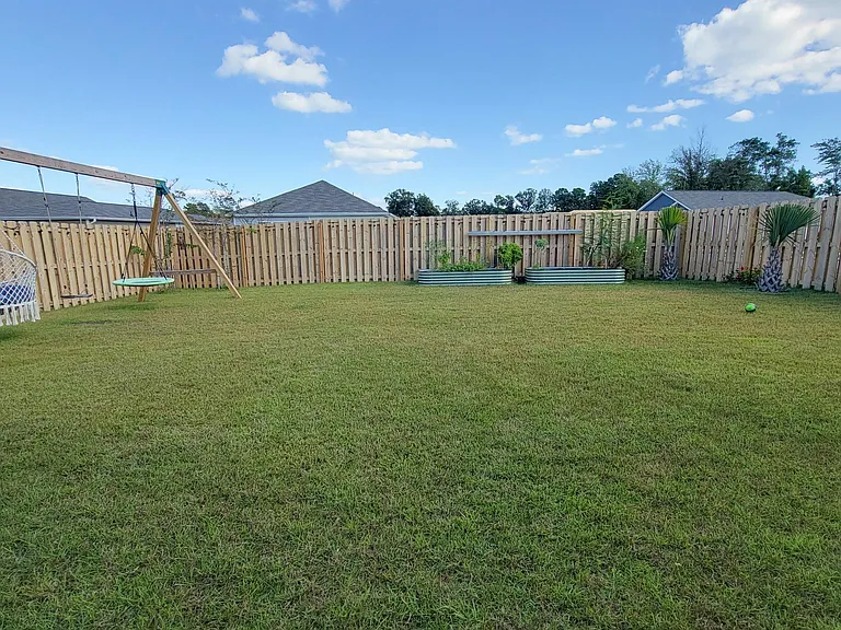 Backyard with raised garden beds