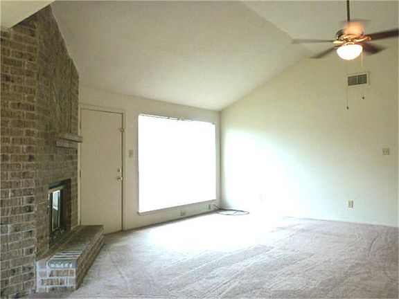 Another view toward the back door and large window overlooking the back-yard.