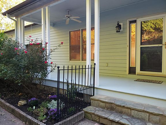 Front porch, roses, and herb garden