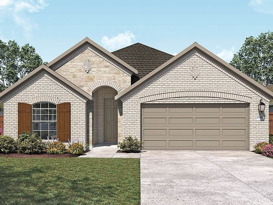 Elegant brick facade and arched windows define this exquisite Anthem residence.