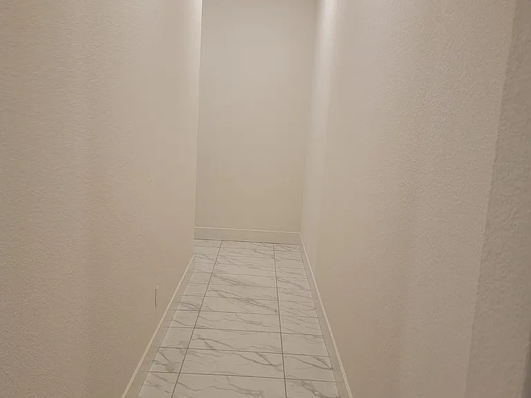 HALL VIEW TO ENTER 3 OF THE 4 BEDROOMS