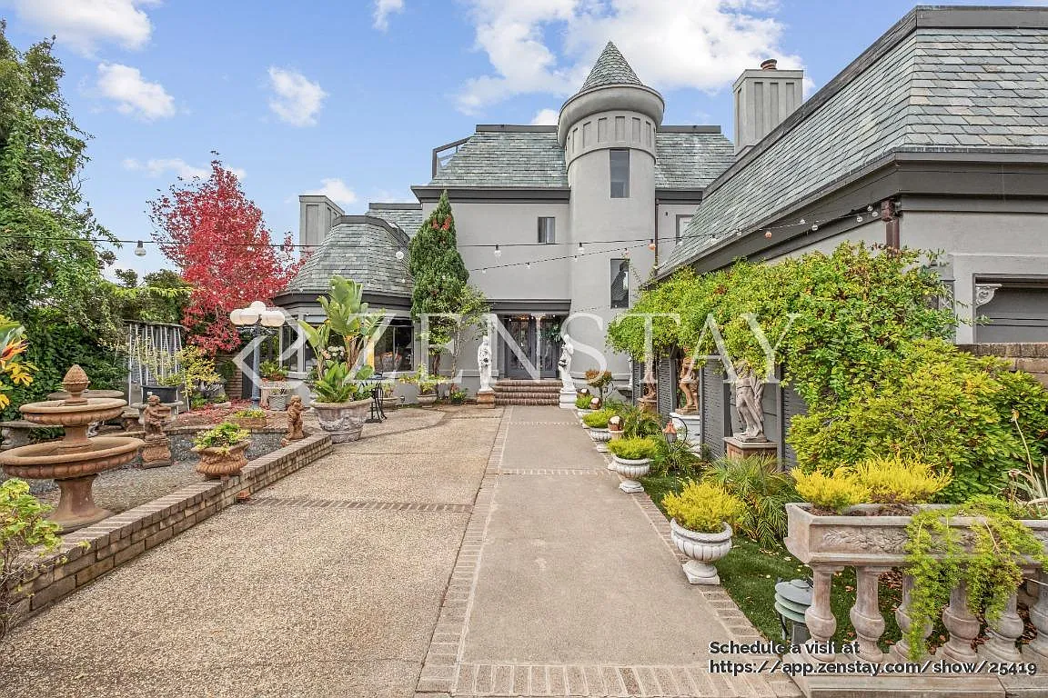 Tudor Revival Castle gated entrance - 121 Great Circle Dr