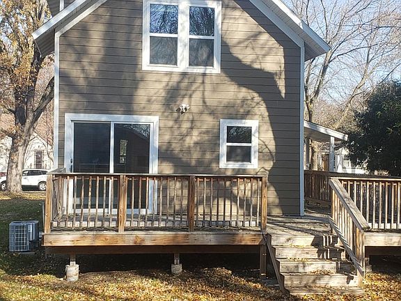 back yard view of house with large deck