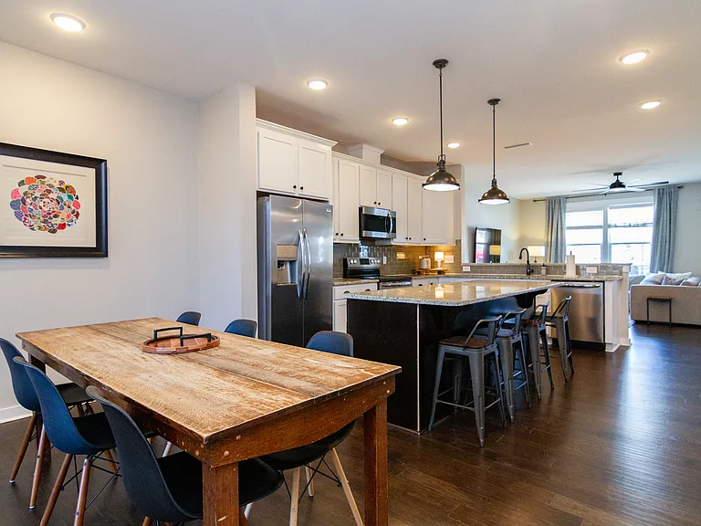 A true farm table from the Kansas prairie warms up the space and has hosted many family meals of our own.