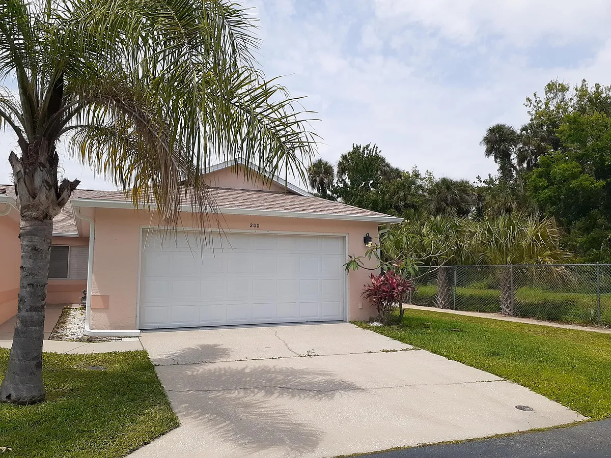 2 car attached private garage, walking path goes down to the Intercoastal Waterway. There's a private dock and georgeous grove area with picnic tables, vollyball court, and horseshoes. - 200 Channel Ct