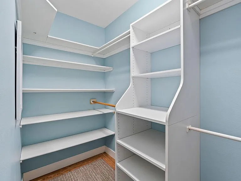 Large Master Bedroom Walk-in Closet with Built-ins