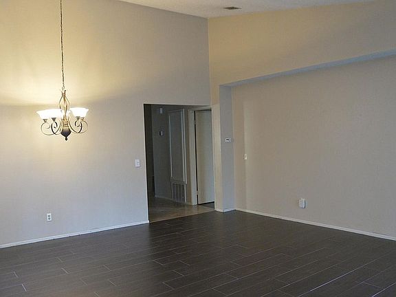 DIning/living room with wood plank tile installed in August 2018.