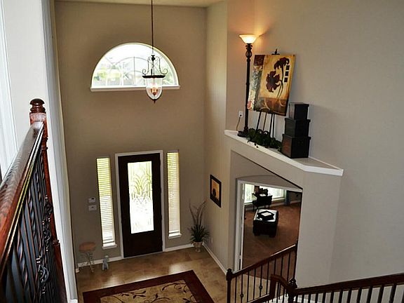 Beautiful Entry with Ceramic Tile Cascading Through to the Family Room