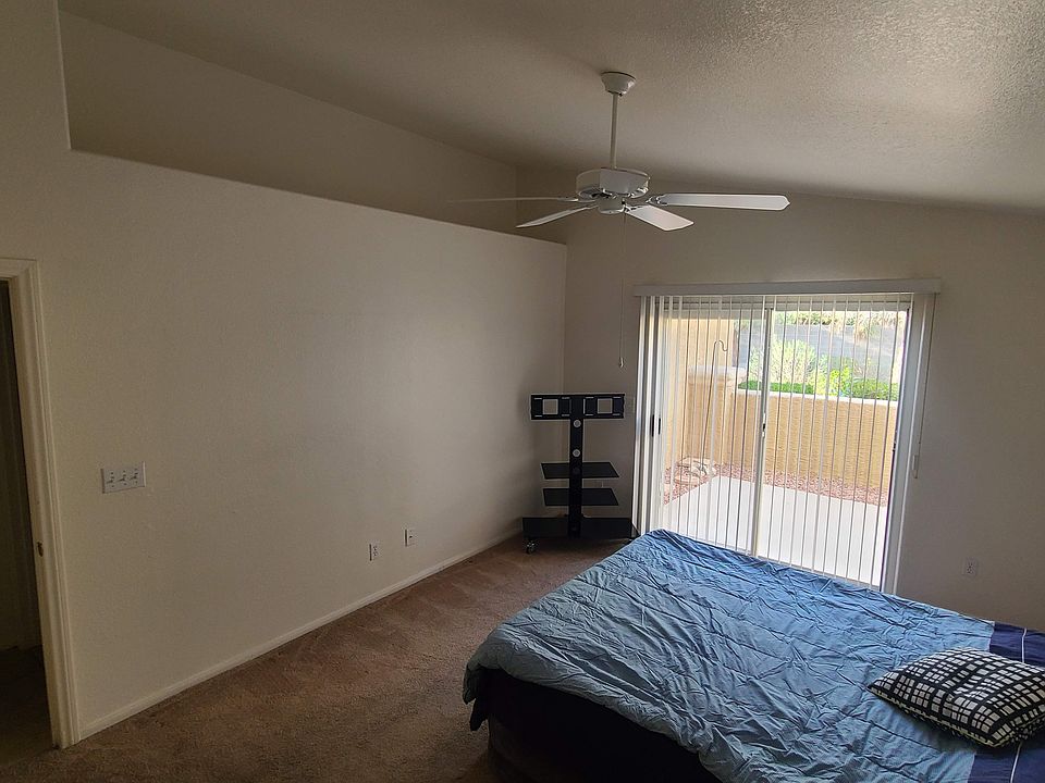 Hight ceilings with ceiling fan. View of sizeable garden area on a very quiet street. Door has immediate access to garage for added entry/exit convenience and privacy.