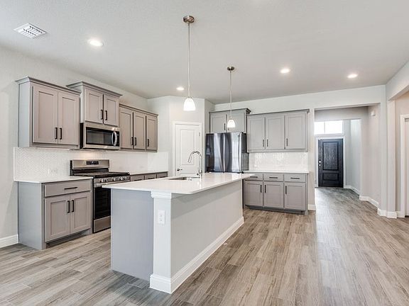 Upgraded cabinetry, new fridge, stainless steel appliances, pantry, plenty of storage.