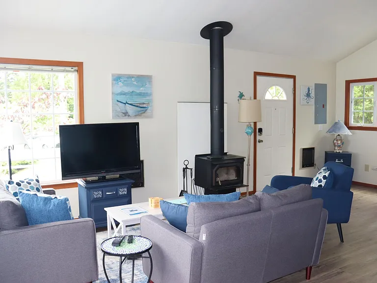 Living Room, complete with cozy wood stove for winters. Wall heating also available.