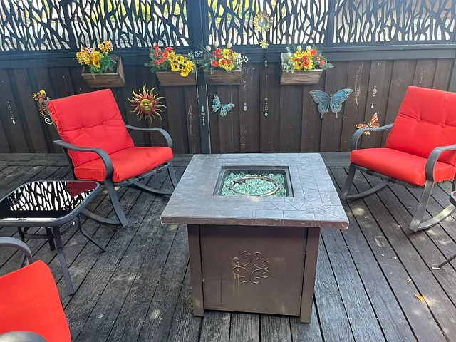The outside propane fireplace is beautiful and warm to sit around with friends and family.