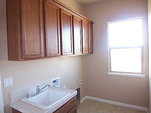 Laundry room with sink, whole house central vacumn