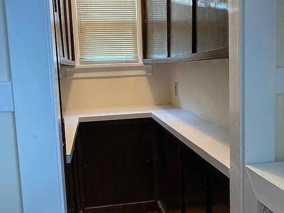 Updated pantry with plenty of cupboard space.