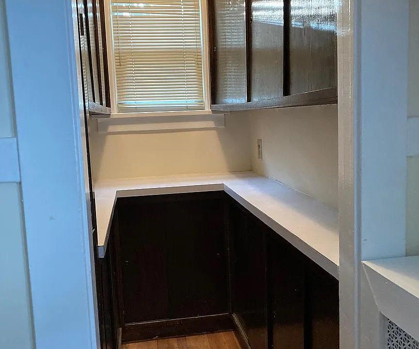 Updated pantry with plenty of cupboard space.