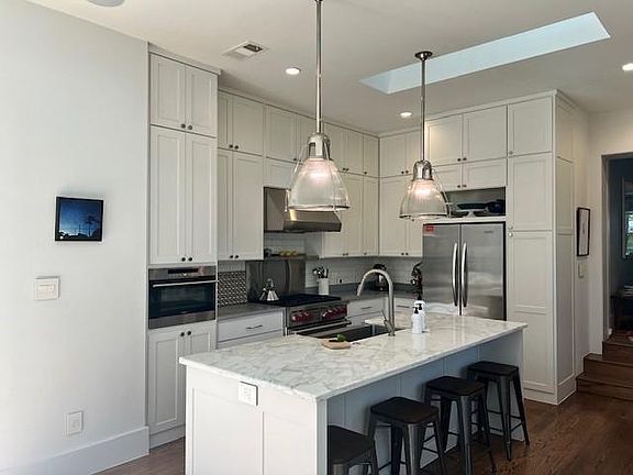 Wolf 36" range, steam oven and 36 bottle wine cabinet