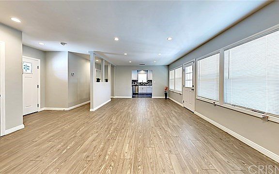 New laminated hardwood floors in over-sized living room