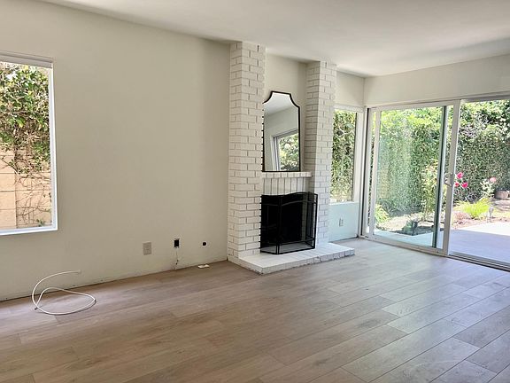Hearth Room with wet bar & gas fireplace, floors just installed, still need to install window treatments and baseboards