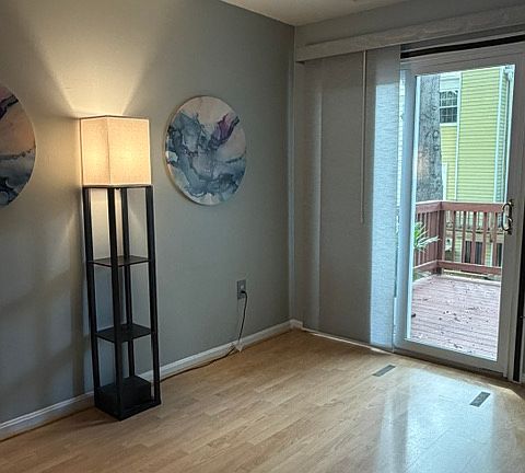 Living room with sliding doors leading out to deck