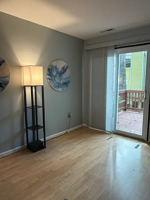 Living room with sliding doors leading out to deck
