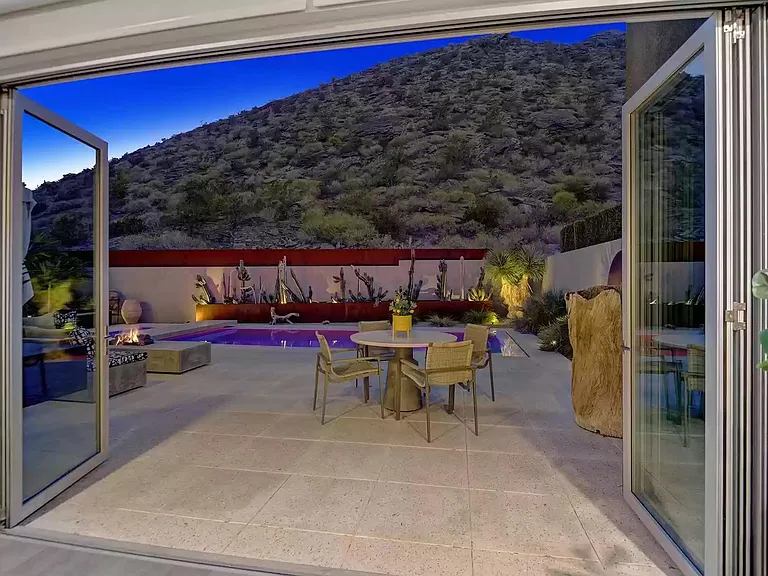 View from the great room to the backyard at night.