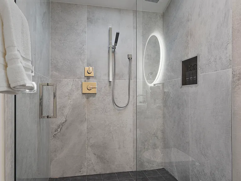 Walk-in shower with a sky light.